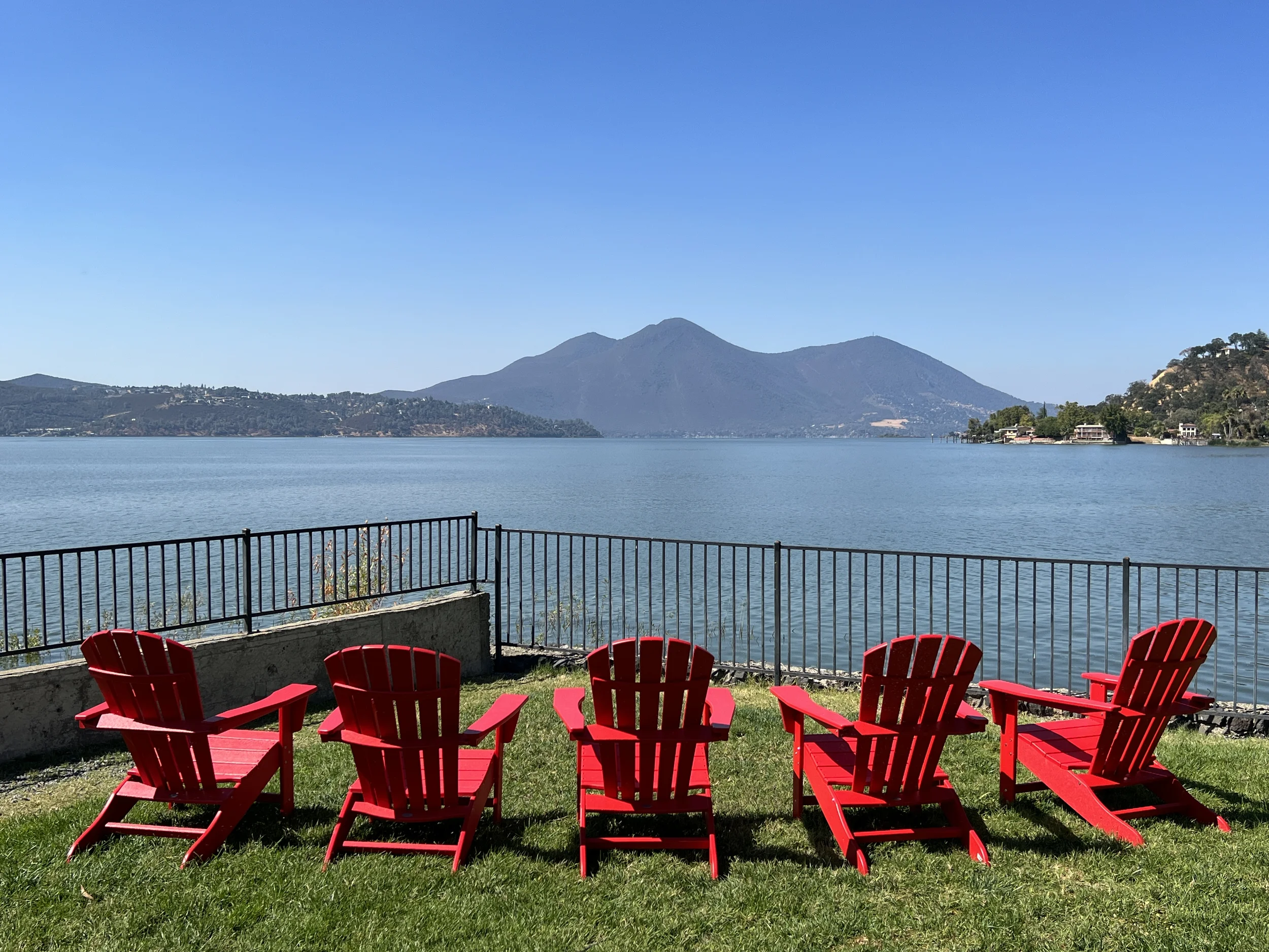 Guests can relax and enjoy the peaceful lake, winery and sunset views in our Adirondack chairs